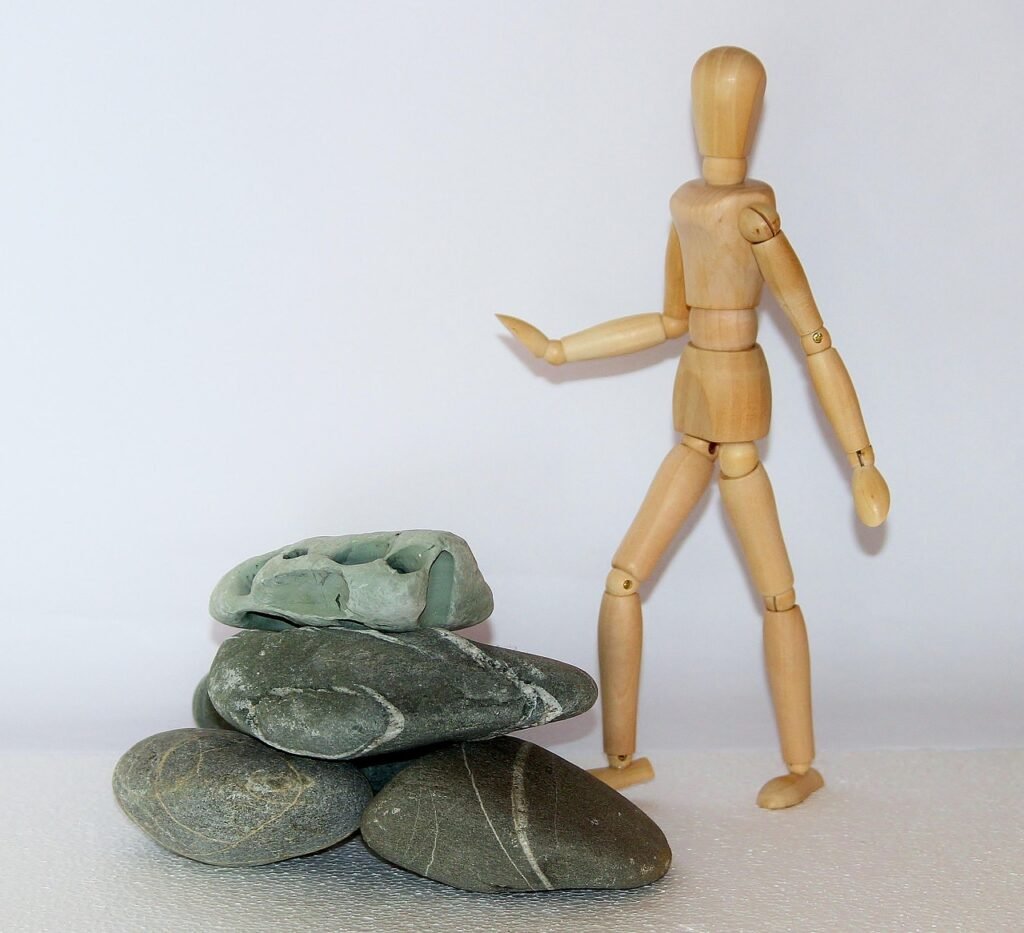 wooden figure, resistance, difficulties, stones in the way, stones, obstacles, struggle for life, overcome, get ahead, find your own way, stop, insurmountable, stuck, resistance, resistance, difficulties, obstacles, obstacles, obstacles, stuck, stuck, stuck, stuck, stuck